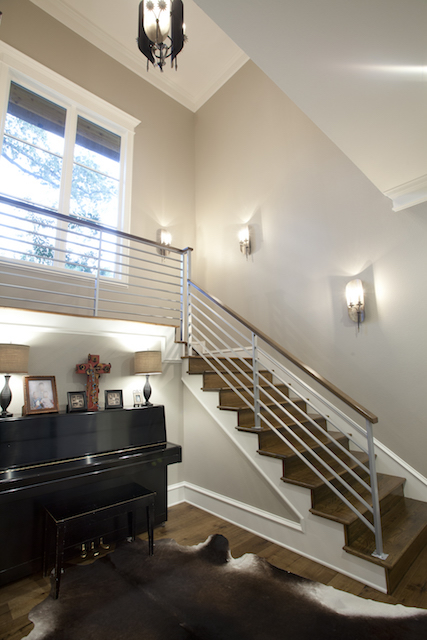 Elegant staircase in a modern, transitional custom home by Trent Williams Construction Management, Tyler, Texas